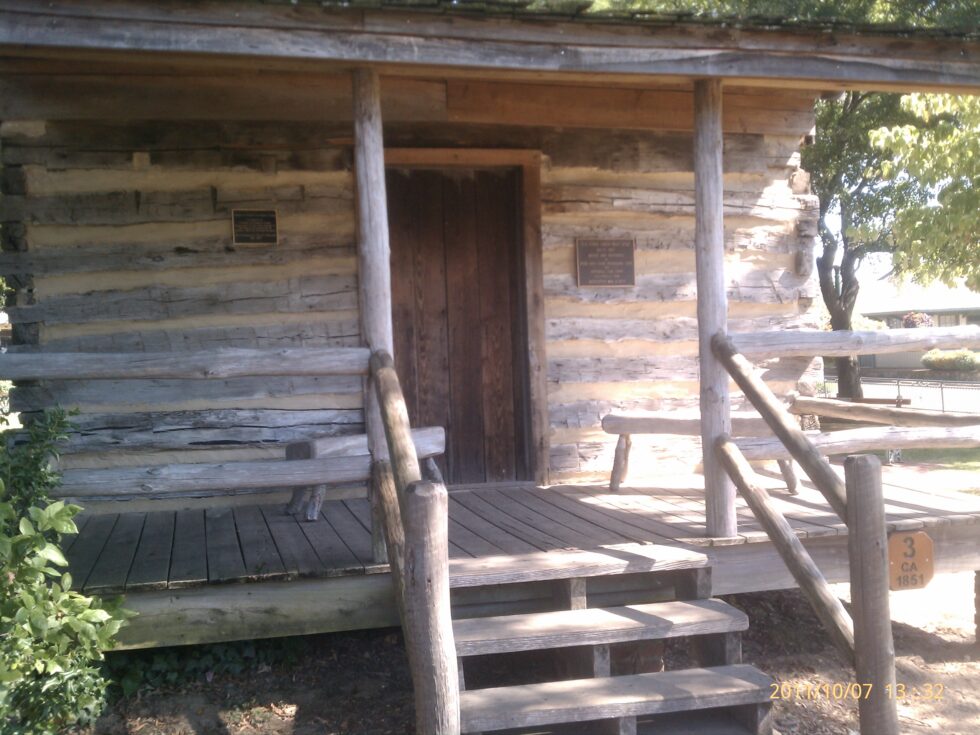 Historic log cabin at Town Square Park in Collierville, Tennessee